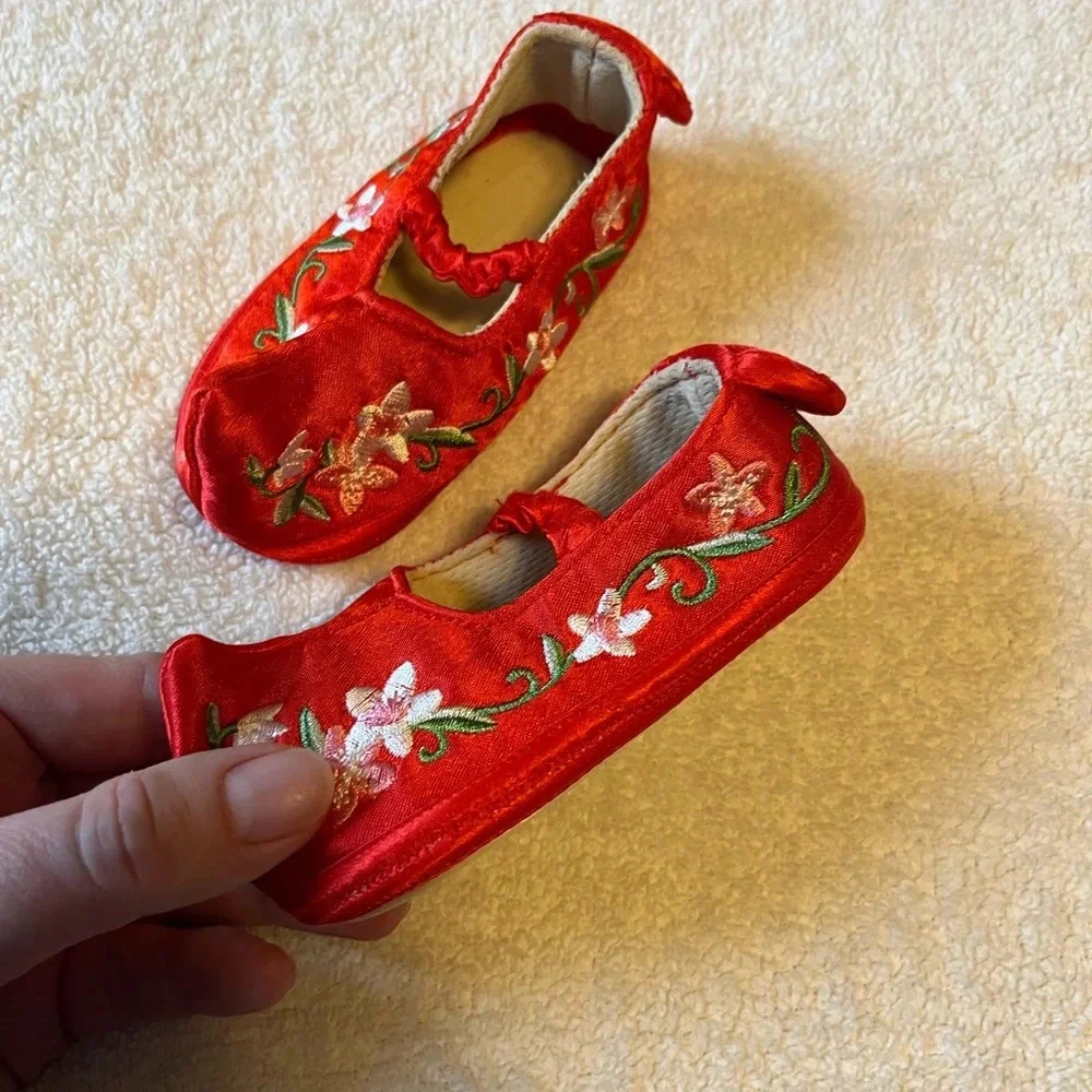 NEW baby shoes, satin red with floral embroidery. Baby size 6-12 months